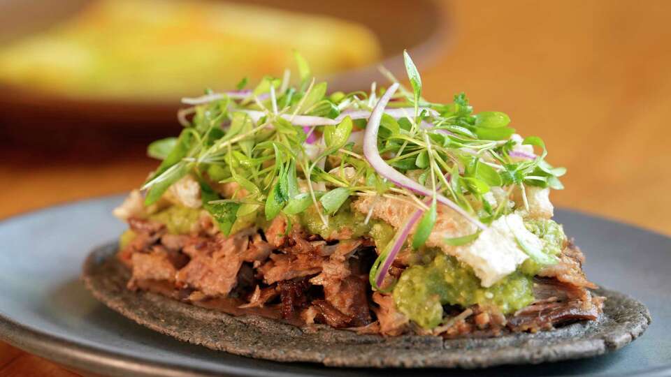 Duck carnitas huaraches is shown at Maximo in West University Place, Friday, June 20, 2025.