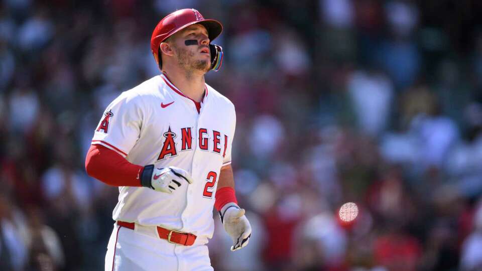 Los Angeles Angels' Mike Trout reacts after hitting a fly ball to end the game iin the ninth inning of a baseball game against the Houston Astros, Sunday, June 22, 2025, in Anaheim, Calif. (AP Photo/William Liang)