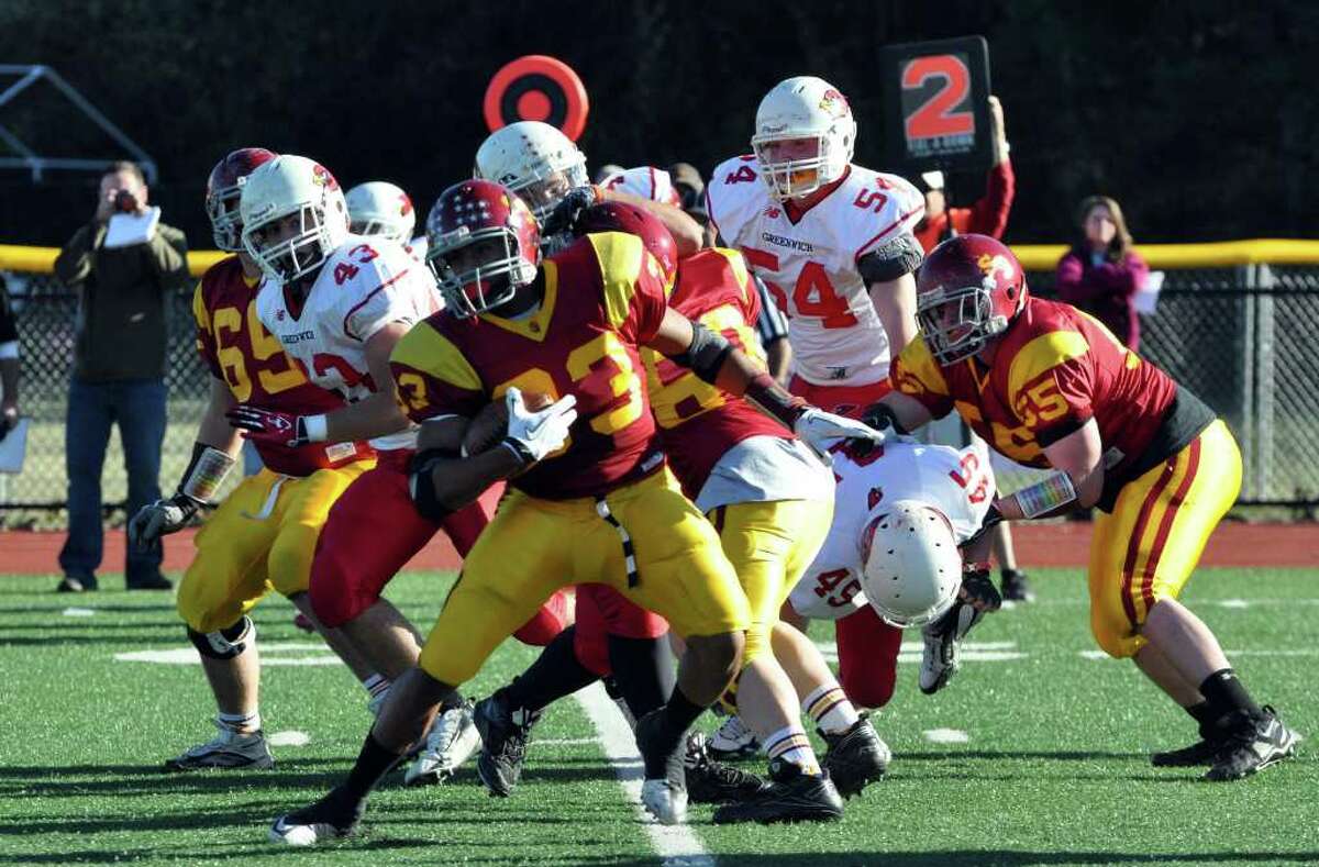 St. Joseph's L.J. Hunt (33) carries the ball during the football game against Greenwich at St. Joseph in Trumbull on Saturday, Nov. 13, 2010.