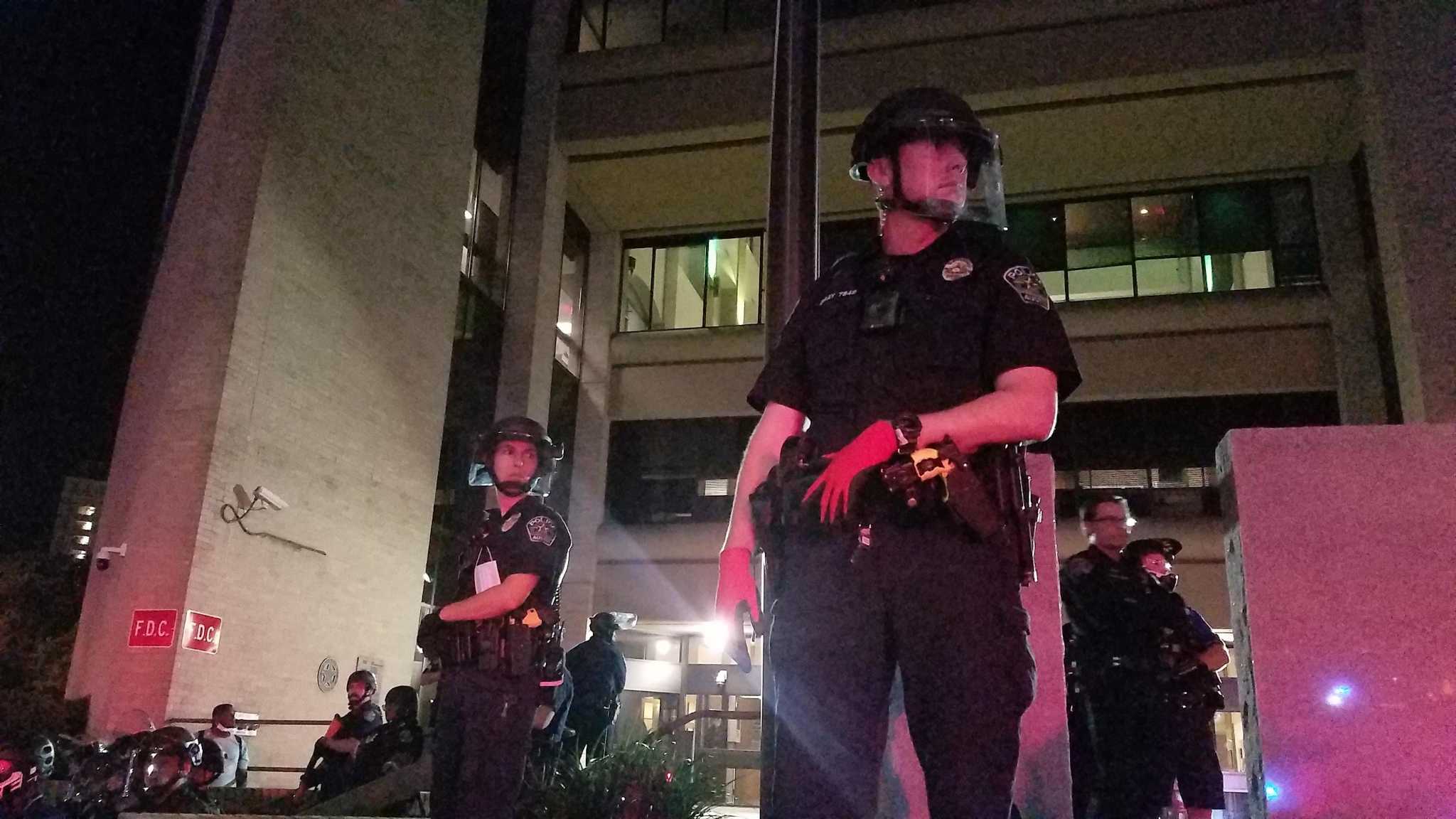 Dozens protest George Floyd's death in front of Austin police headquarters