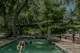 Krause Springs has a spring-fed swimming pool and is less than an hour away from Austin.