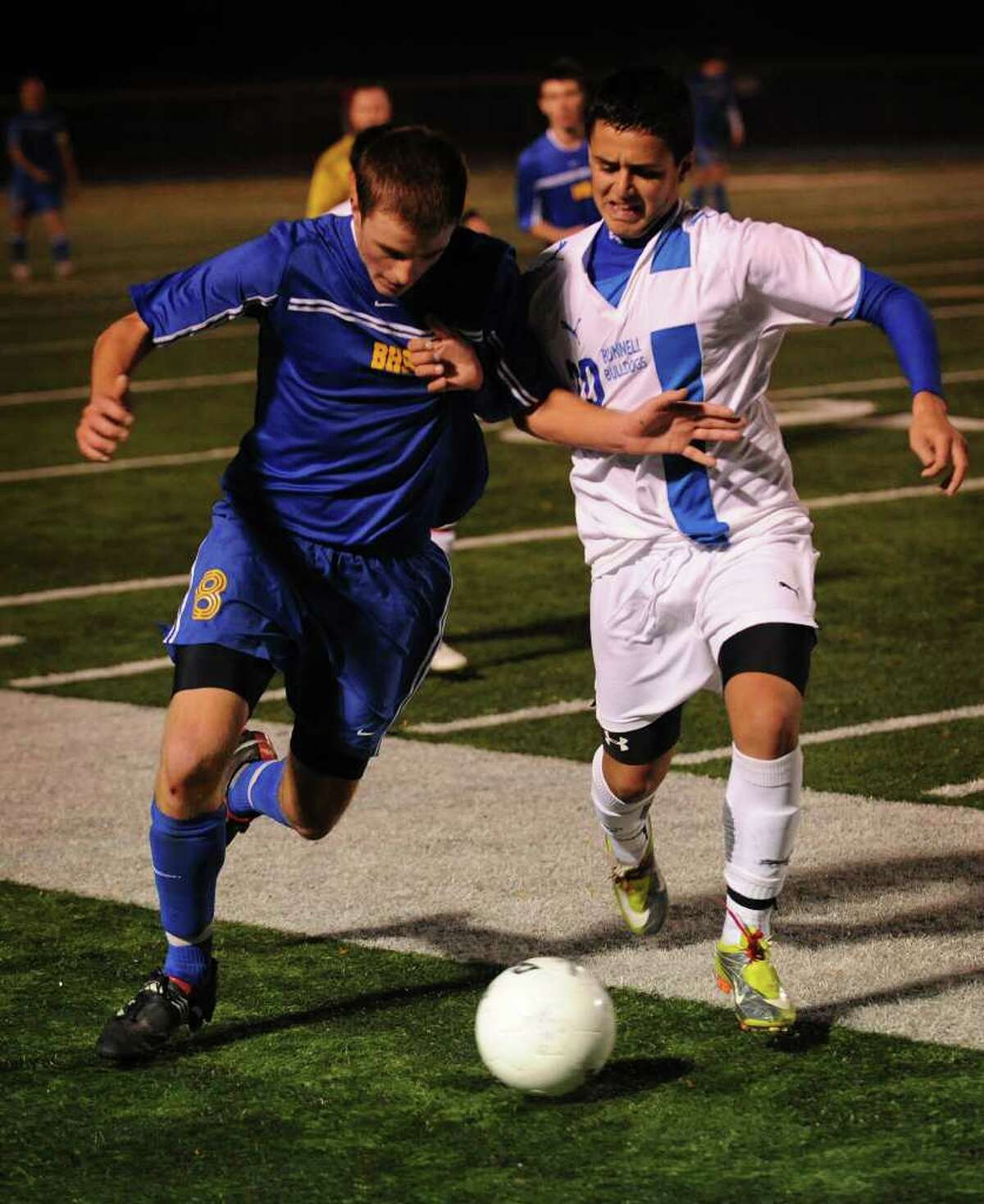 Brookfield's Collin Burke, left, battles for the ball with Bunnell's Christopher Carniero during their Class state tournament matchup at Bunnell High School in Stratford on Monday, November 15, 2010. Bunnell won the game on penalty kicks 5-3.