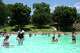 Friends and families splash and swim in Deep Eddy Pool on June 16, 2021.