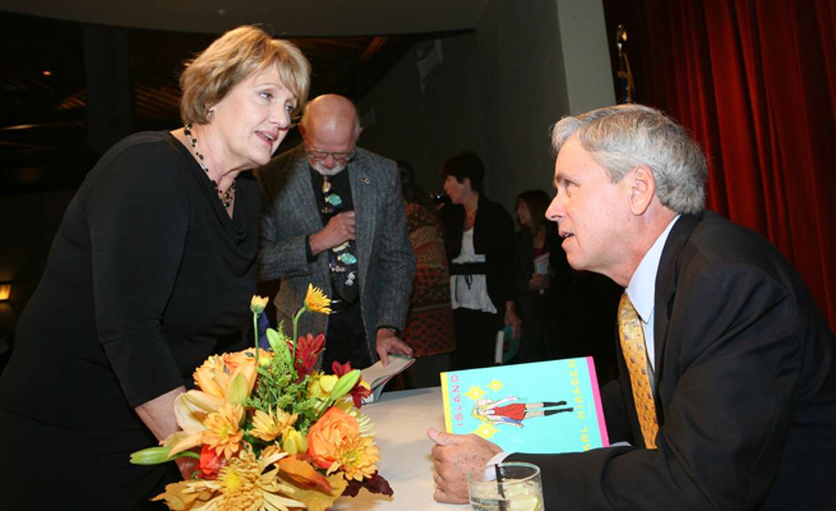 Ann Young talks with novelist and Miami Herald columnist Carl Hiaasen at the San Antonio Public Library Foundation's Copyright Texas fundraiser dinner at Pearl Stable.