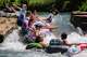 Tubers embrace the splash as they head into the rapids of the San Marcos River near Rio Vista Park in San Marcos, July 26, 2022.