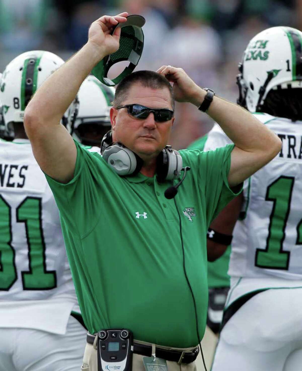 This Sept. 18, 2010, file photo shows North Texas head coach Todd Dodge during a time out in the first half of an NCAA college football game against Army, in West Point, N.Y. North Texas has fired coach Dodge after 3 1/2 unsuccessful seasons. (AP Photo/Mike Groll, File)