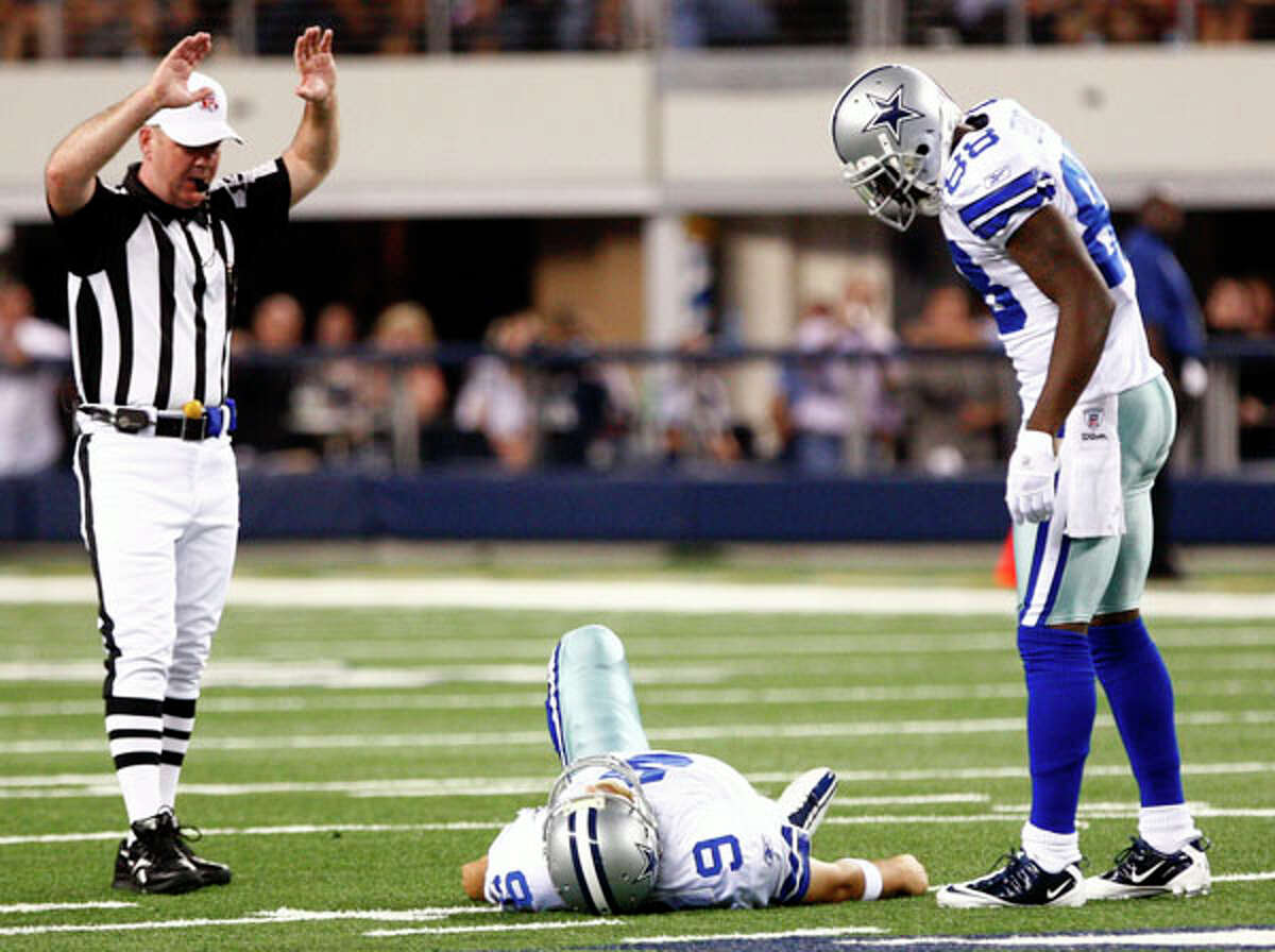 Dallas Cowboys Tony Romo throws a pass out of his own endzone in