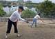 Volunteer Liz Wommack, left, and Susan Rankin, director of the Trail Foundation, background, plant wildflower seeds on the hillside of Vista Pointe on Lady Bird Lake.