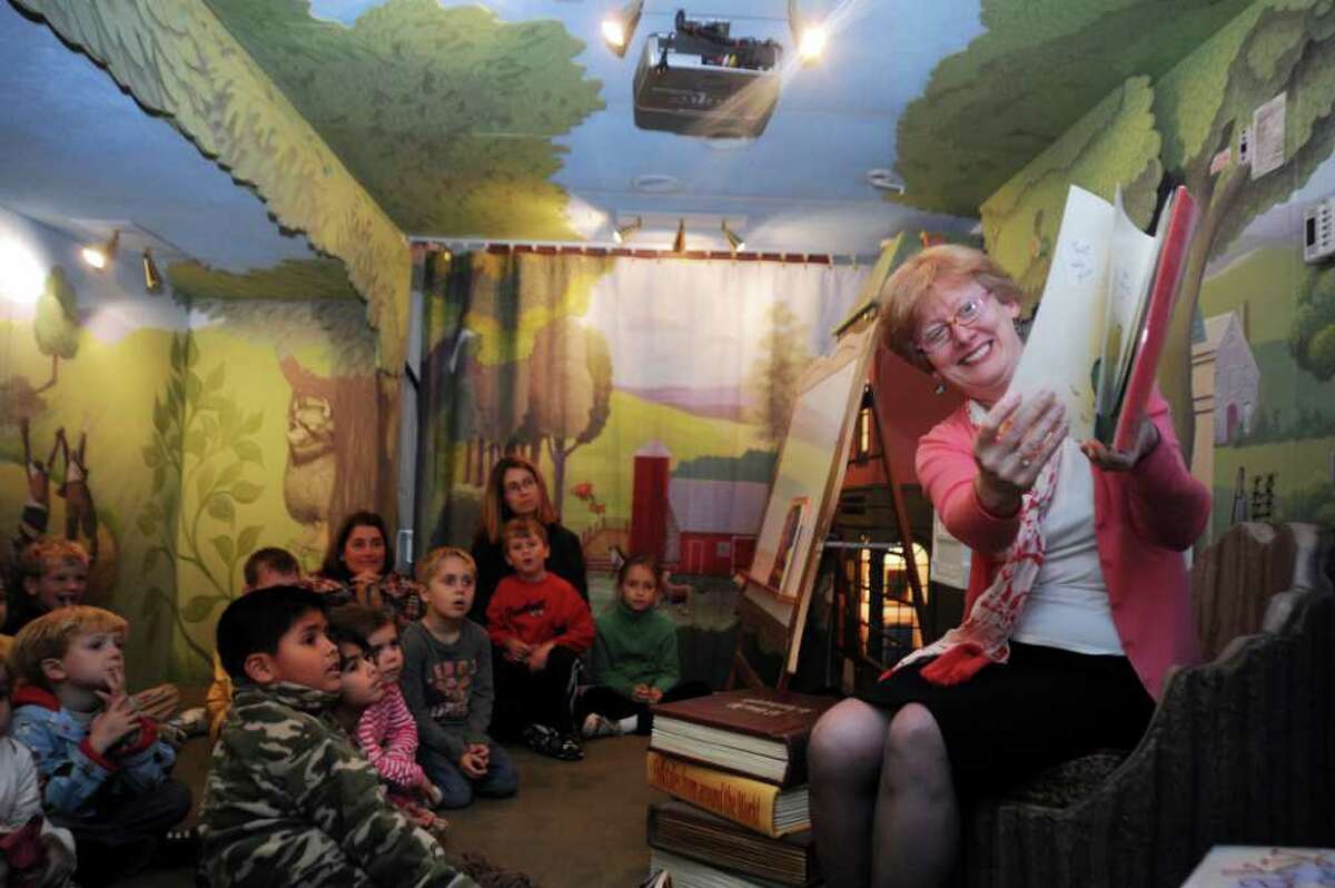 Kathy Jarombek, director of youth services at the Perrot Memorial Library, reads to children in the Storymobile to honor "Kathy's Corner," on Tuesday, Nov. 16, 2010. "Kathy's Corner" is to remember librarian Kathleen Krasniewicz who was killed by a drunken driver in Denver two years ago.