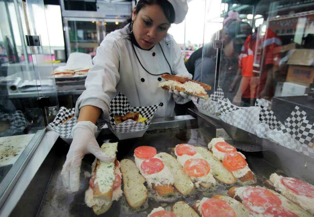 Fans eat in one of the many food options at AT&T Park in San Francisco,  Thursday, Oct. 28, 2010, where the San Francisco Giants and the Texas  Rangers are meeting in Game