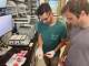 UC Davis researchers Mark Salazar, left, and Brett Poulin in a lab with disposable vape pods. Their study found some disposable vapes emit more toxic metals — including lead and nickel — than traditional cigarettes.