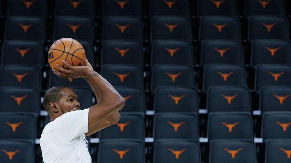 Phoenix Suns forward Kevin Durant (35) warms up on the court before an NBA game against the San Antonio Spurs at Moody Center on Thursday, Feb. 20, 2025, in Austin, Texas. Durant played his lone college season at the University of Texas in 2006-07, forging a connection with the Longhorn program and the city of Austin.