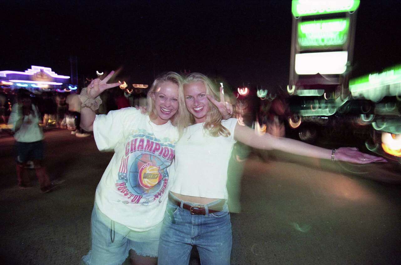 Rockets fans celebrate the team's win over the Magic in the 1995 NBA Finals, June 14, 1995.