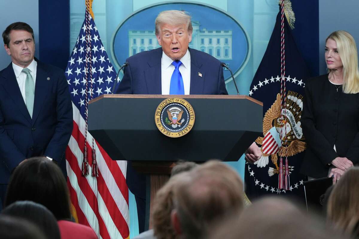 President Donald Trump speaks to the media as Attorney General Pam Bondi, right, and Deputy Attorney General Todd Blance, left, listen, Friday, June 27, 2025, in the briefing room of the White House in Washington.