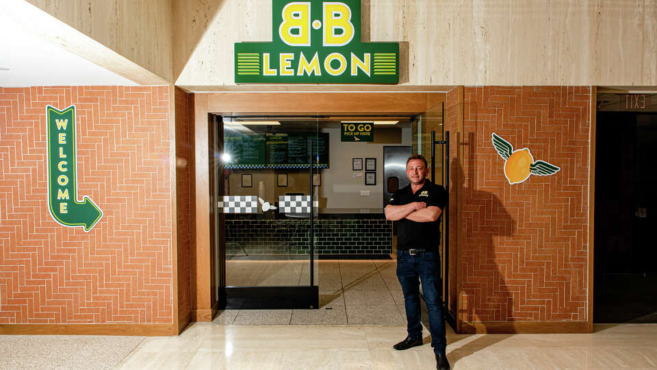 Benjamin Berg stands in front of B.B. Lemon, located in the downtown Houston tunnels. He is being sued by a bank for an unpaid debt. 