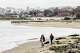 The San Francisco skyline looms over the beach at Crissy Field in the Presidio in 2025. The Presidio was once an Army base.