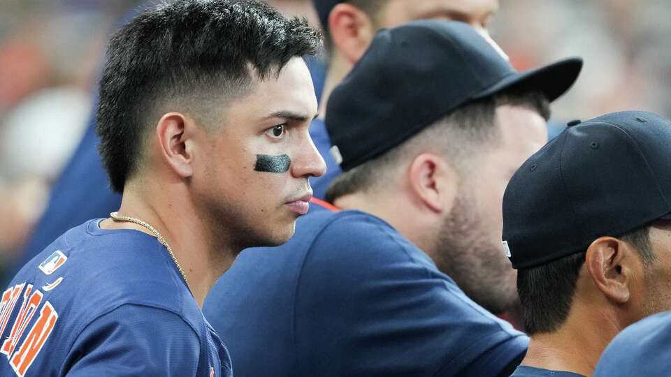 Houston Astros short stop Mauricio Dubón (14) watches his team bat against Chicago Cubs from the dugout at Daikin Park in Houston on Sunday, June 29, 2025.