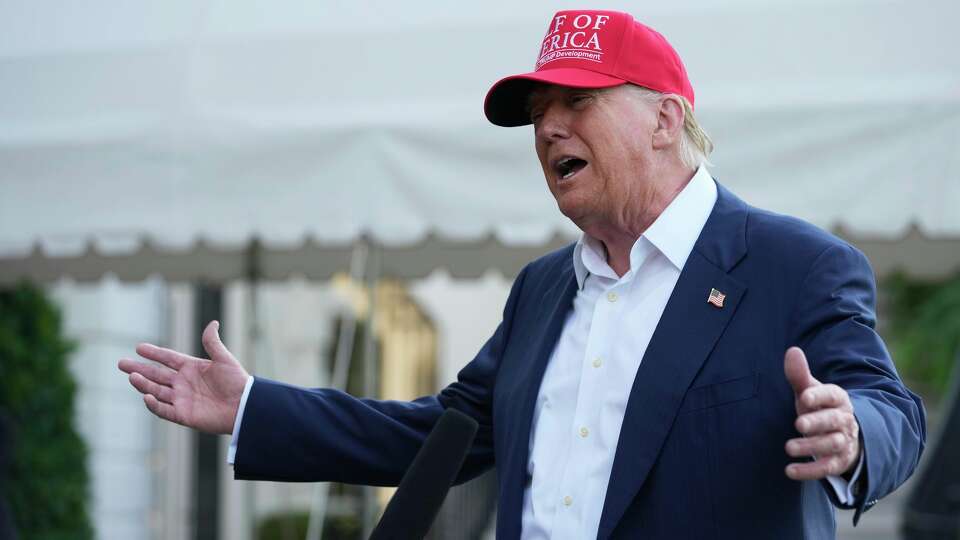 President Donald Trump speaks to the media before walking across the South Lawn of the White House to board Marine One en route to Joint Base Andrews, Md., and on to Florida, Tuesday, July 1, 2025, in Washington.