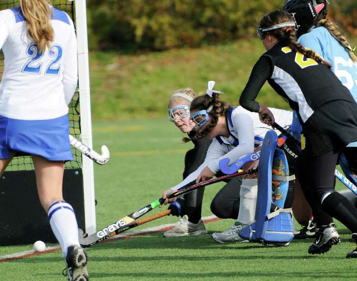 Darien's Leslie Gill #20 stretches to make a first half goal as Darien High School wins against Daniel Hand High School for the Class M field hockey state tournament at Wethersfield High School in Wethersfield, CT on Saturday November 20, 2010.