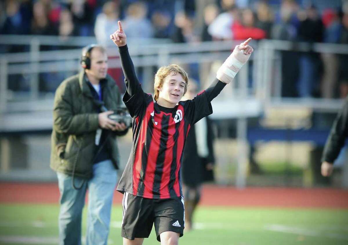 New Canaan's Steven Valente celebrates his teams win over Bunnell in the Class L boys soccer championship match at Fairfield Ludlowe High School in Fairfield, Conn. on Saturday November 20, 2010. New Canaan won the game 2-0.