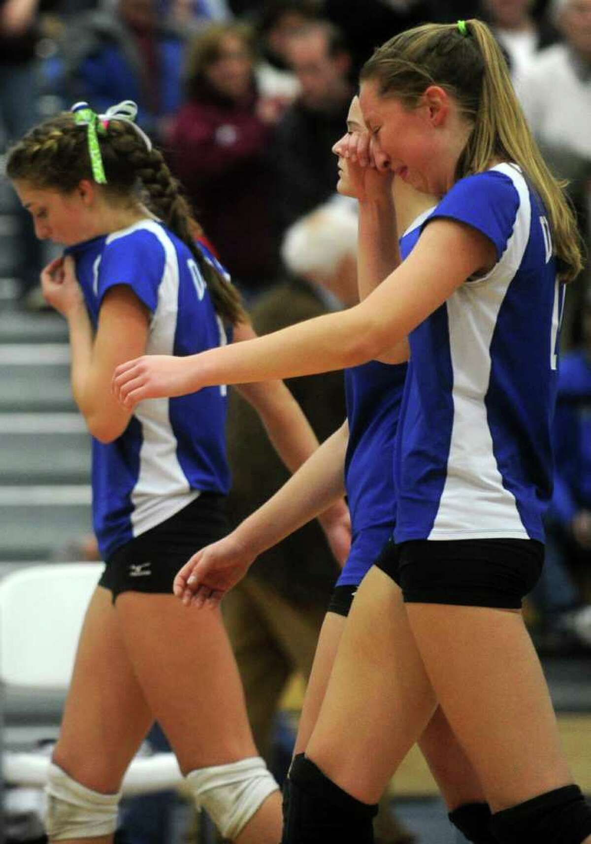 Darien's Katie Stueber, right, and teammates react to losing Saturday's Class L Volleyball Championship game against East Lyme at Glastonbury High School on November 20, 2010.