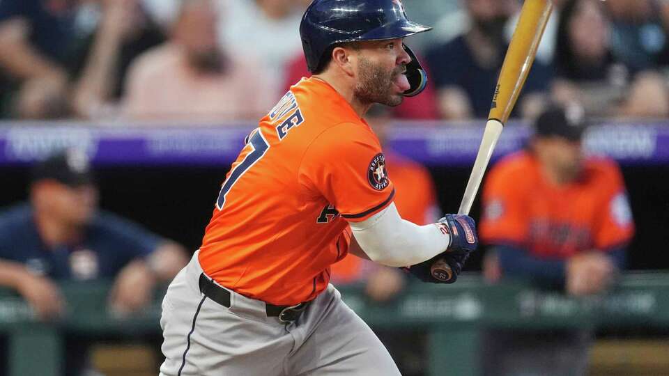 Houston Astros' Jose Altuve follows the flight of his single to drive in two runs off Colorado Rockies relief pitcher Jake Bird in the sixth inning of a baseball game Wednesday, July 2, 2025, in Denver. (AP Photo/David Zalubowski)