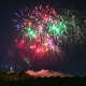 Fireworks burst over Castle Craig in celebration of Independence Day at Hubbard Park in Meriden, Conn., Wednesday, July 2, 2025.