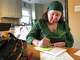 Nurse practitioner Debra Lynch, founder of Delaware-based Her Safe Harbor, writes a note Dec. 5, 2024, to go into a medication abortion package that will be mailed to a patient. "I might be the only person that's speaking to them about this, that actually knows what they're going through," she said. "I'm just trying to let them know that I am here for them."