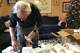 From the living room of his Delaware home, Jay Lynch assembles 22 medication abortion packages on Dec. 5, 2024 for Her Safe Harbor. His wife, nurse practitioner Debra Lynch, founded the telehealth service to reach patients in abortion-restricted states.
