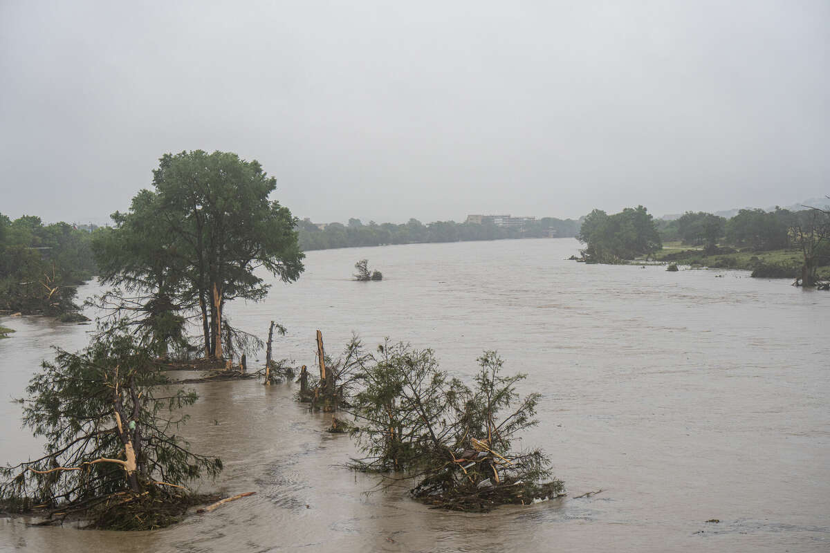 Trees emerge from flood waters along the Guadalupe River on July 4, 2025 in Kerrville, Texas.