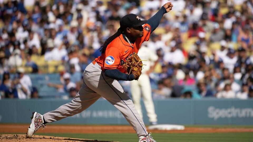 Houston Astros starting pitcher Framber Valdez delivers during the first inning of a baseball game against the Los Angeles Dodgers in Los Angeles, Saturday, July 5, 2025. (AP Photo/Kyusung Gong)
