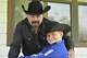 Shiloh Wilson, 12, with his dad, Jeff Wilson. They and his mother, Amber, died in last weekend\'s Hill Country flood.