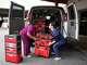 Medical assistant Jalen Reasonover, left, and registered nurse Lana Sherrill load medical equipment and supplies into the Central Health Mobile Bridge Clinic van at the Central Health Clinical Education Center in March. Central Health has added more mobile clinic capacity to its program.