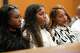 Tia Jones, middle, her friend Paige Ellis and her mother Kristine Jones wait for hearing about a protective order against Kansas City Chiefs player Xavier Worthy, not in attendance, at the Williamson County Justice Center in Georgetown Tuesday April 1, 2025.
