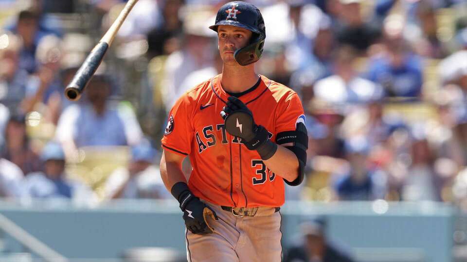 Houston Astros' Zack Short tosses his bat after being walked during the sixth inning of a baseball game against the Los Angeles Dodgers, Sunday, July 6, 2025, in Los Angeles. (AP Photo/Jessie Alcheh)