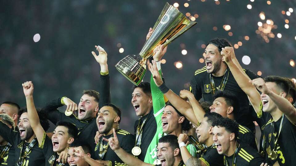 Mexico holds up the Concacaf Gold Cup trophy after it's 2-1 win over USA at NRG Stadium in Houston on Sunday, July 6, 2025. Mexico won the game 2-1.