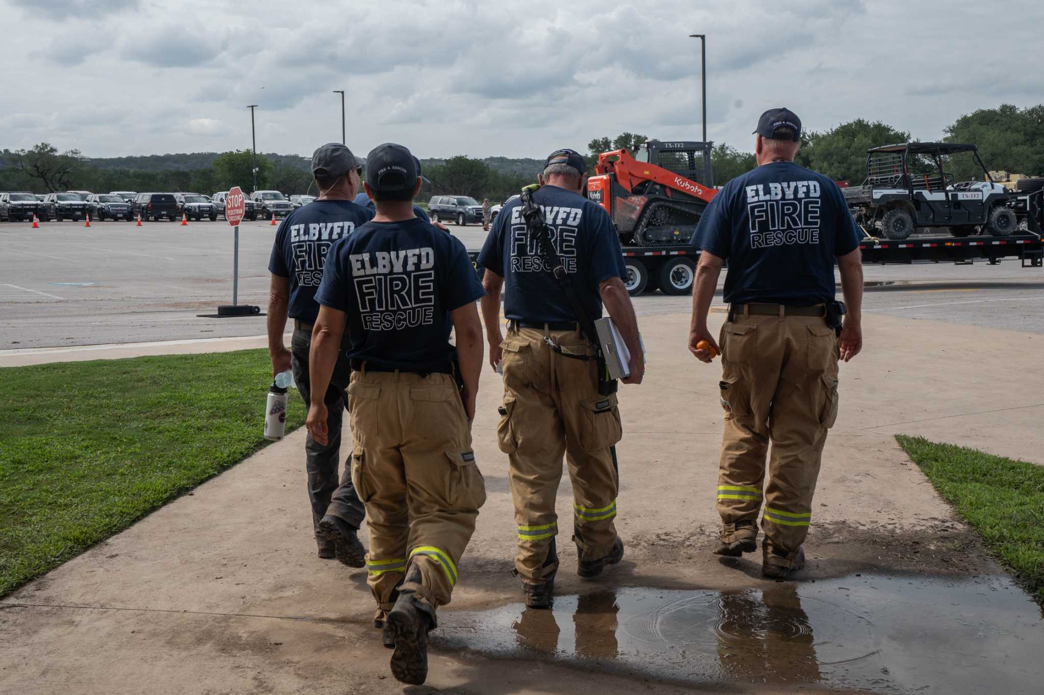 Firefighters search for one of their own after devastating floods