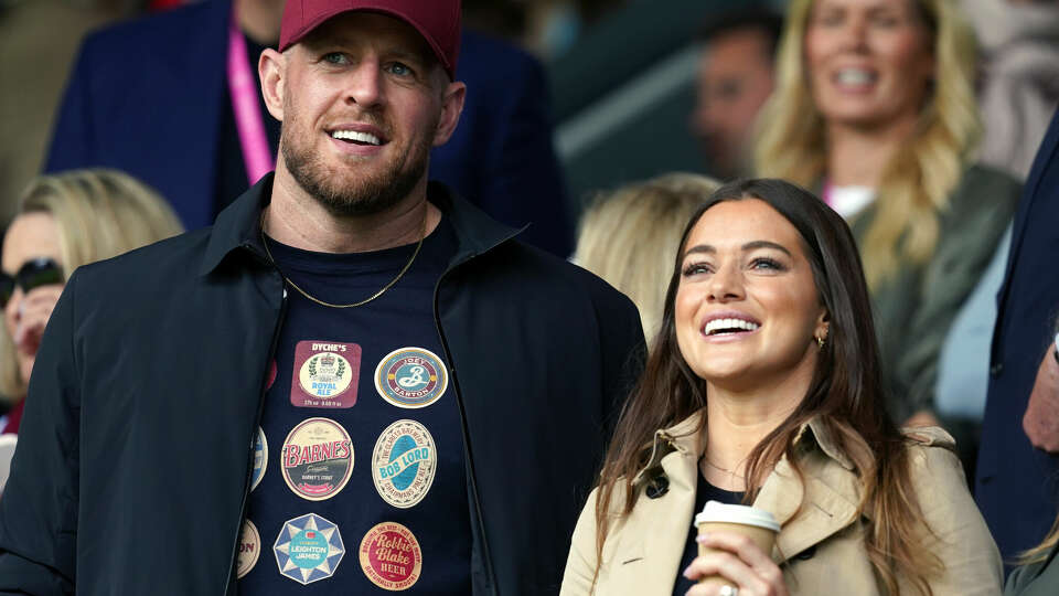 Houston sports legends J.J. Watt and Kealia Watt, who are minority shareholders in Burnley Football Club, watch from the stands during the Sky Bet Championship match at Turf Moor, Burnley on May 8, 2023.