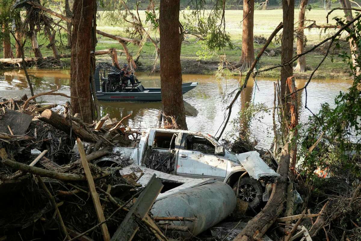 First responders on an airboat do search and recovery work on the Guadalupe River in Ingram, Tuesday, July 8, 2025, after the Fourth of July flood.