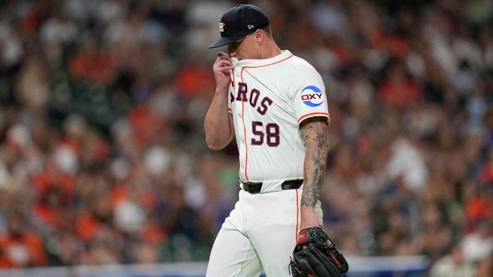 Houston Astros starting pitcher Hunter Brown wipes his face after throwing against the Cleveland Guardians during the sixth inning of a baseball game Tuesday, July 8, 2025, in Houston. (AP Photo/David J. Phillip)