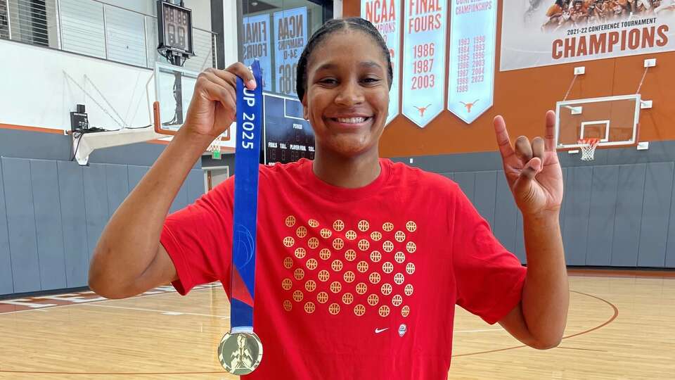 Madison Booker with her gold medal from recent Team USA win at FIBA Women's AmeriCup.