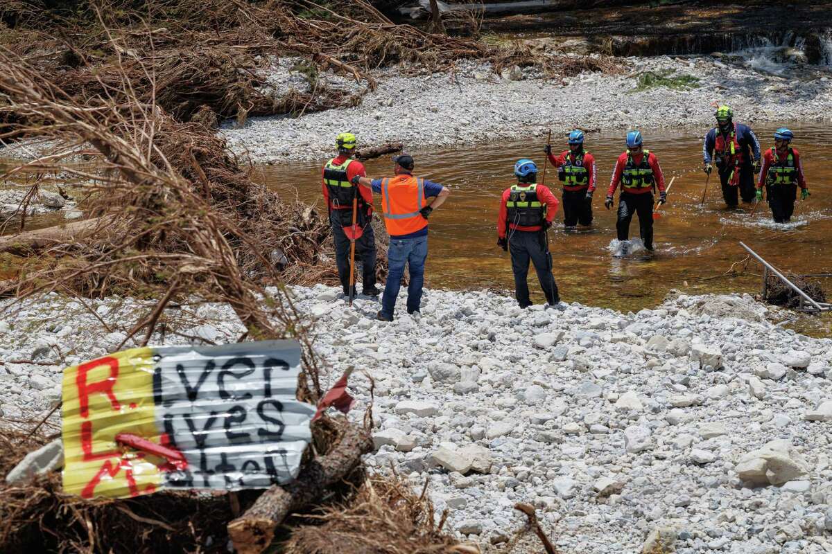 A team of firefighters from Ciudad Acuña, Mexico, conducts a search and rescue operation in the Guadalupe River near Camp Mystic on Thursday, July 10, 2025, in Hunt, Texas. Nearly a week after a devastating flash flood hit the Texas Hill Country, first responders from across the state and Mexico continue to work together to find missing persons.