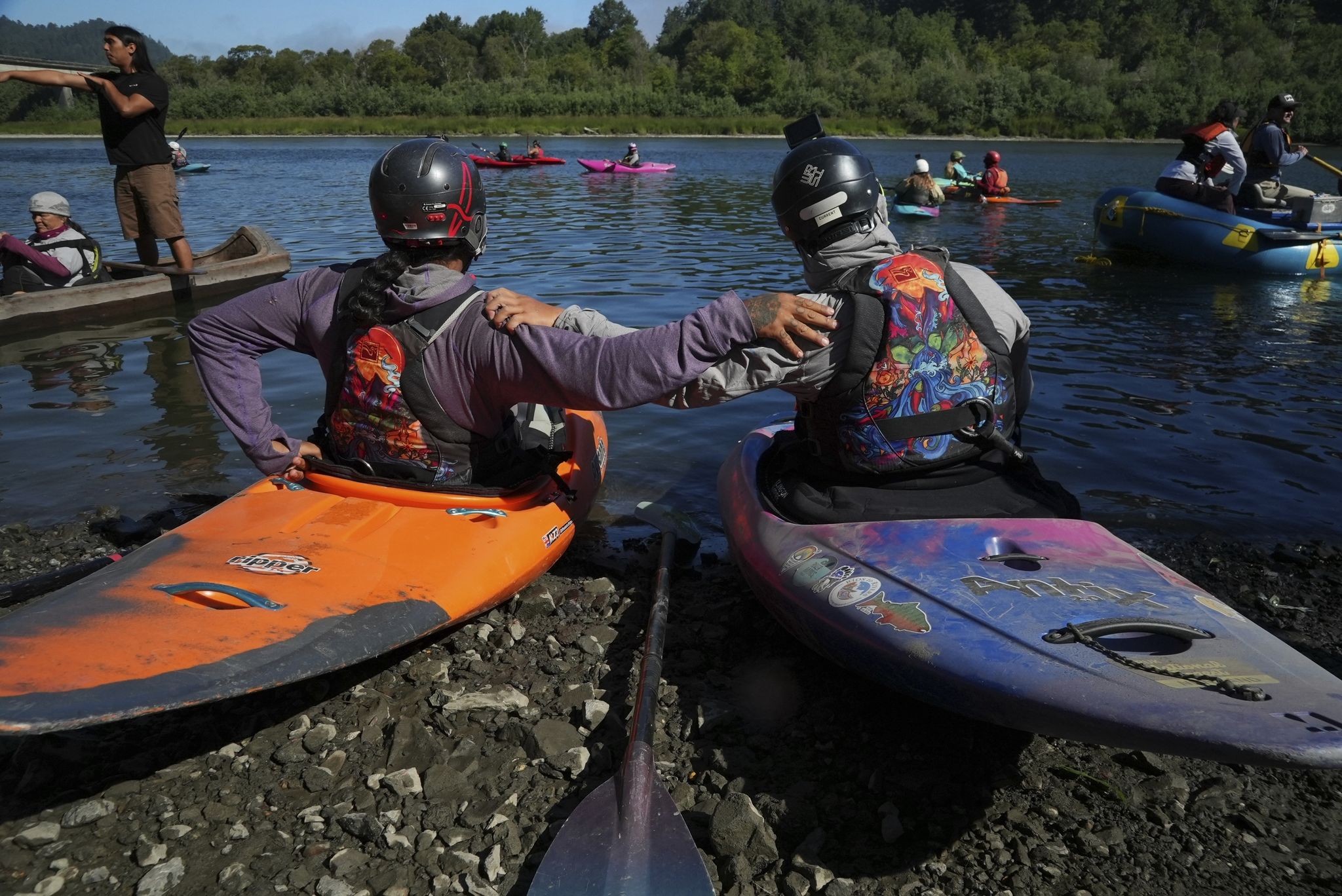 Native American teens kayak major - RawImage
