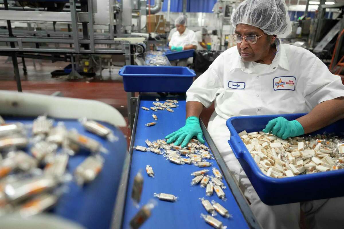 Carolyn Simmons, a 46-year employee, sorts Peanut Butter Bars at the Atkinson Candy Company in Lufkin Friday, July 11, 2025. The candy Peanut Butter Bars is being rebranded as Zebra Bars.
