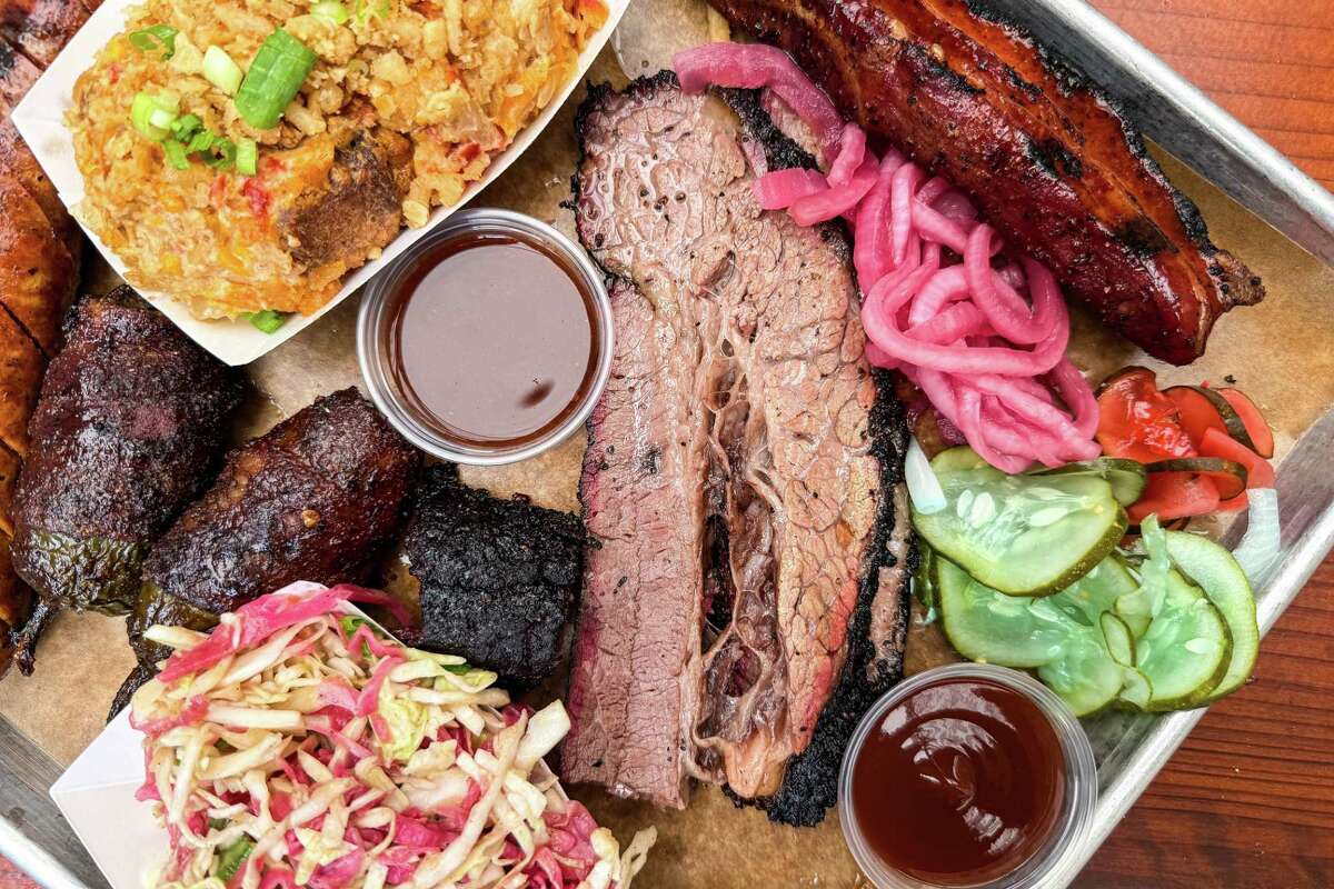 Brisket, cole slaw, Chicago twinkies (bacon wrapped jalapenos), cheddar-jalapeno sausage, watermelon salad, spicy pickles, tater tot casserole and glazed bacon rib at Green Street Smoked Meats, Chicago