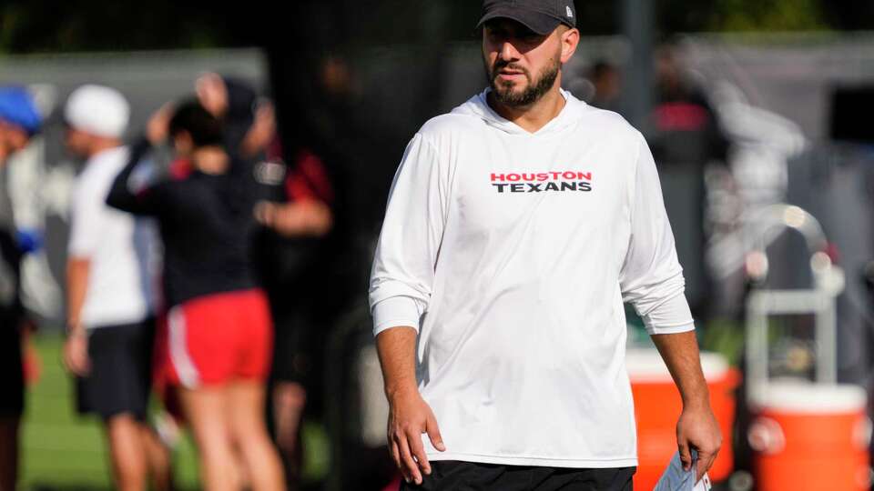 Houston Texans offensive coordinator Nick Caley watches the workout during an NFL training camp practice at Houston Methodist Training Center in Houston, Wednesday, July 23, 2025.