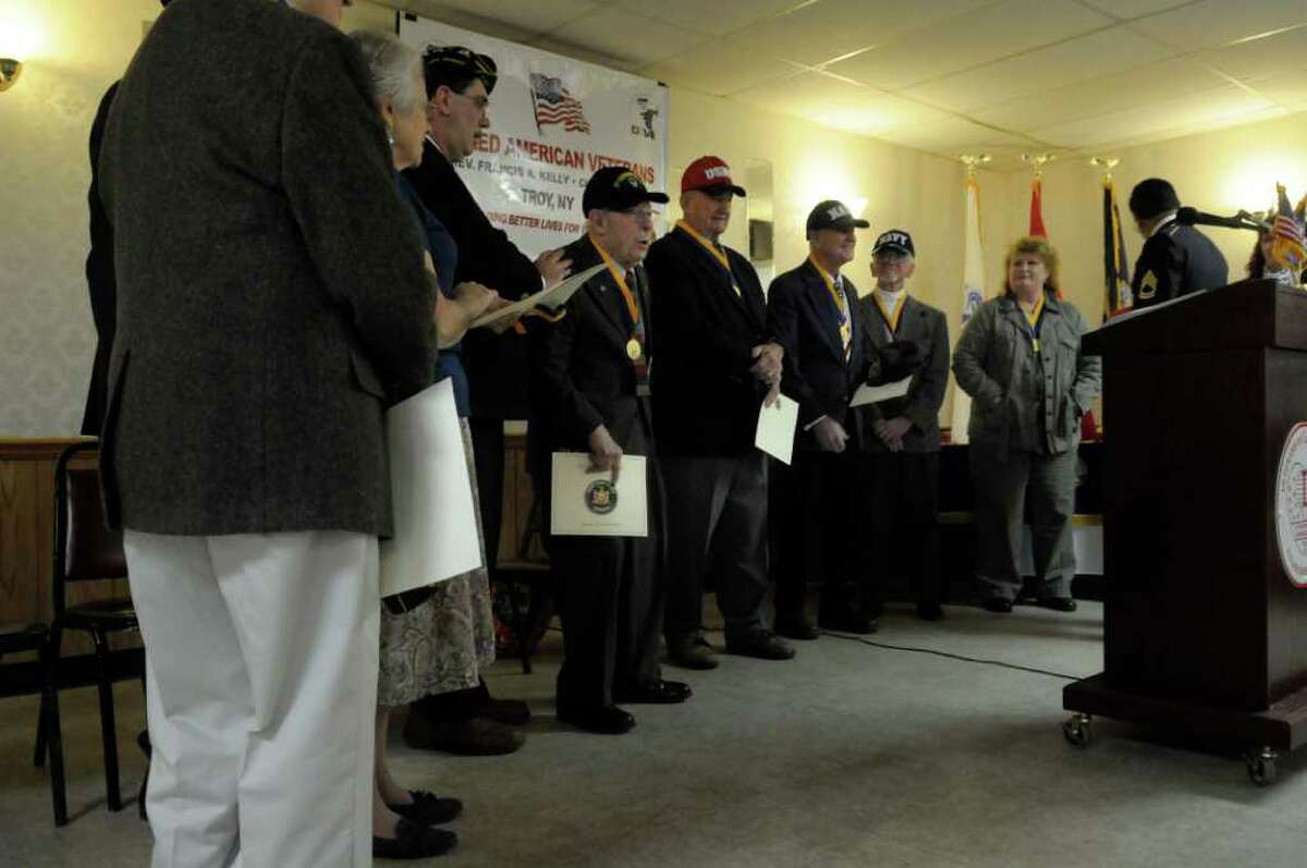 Veterans and the widows of veterans receive applause near the conclusion of the awards ceremony Sunday at the Veterans of Lansingburgh in Troy. (Paul Buckowski / Times Union)