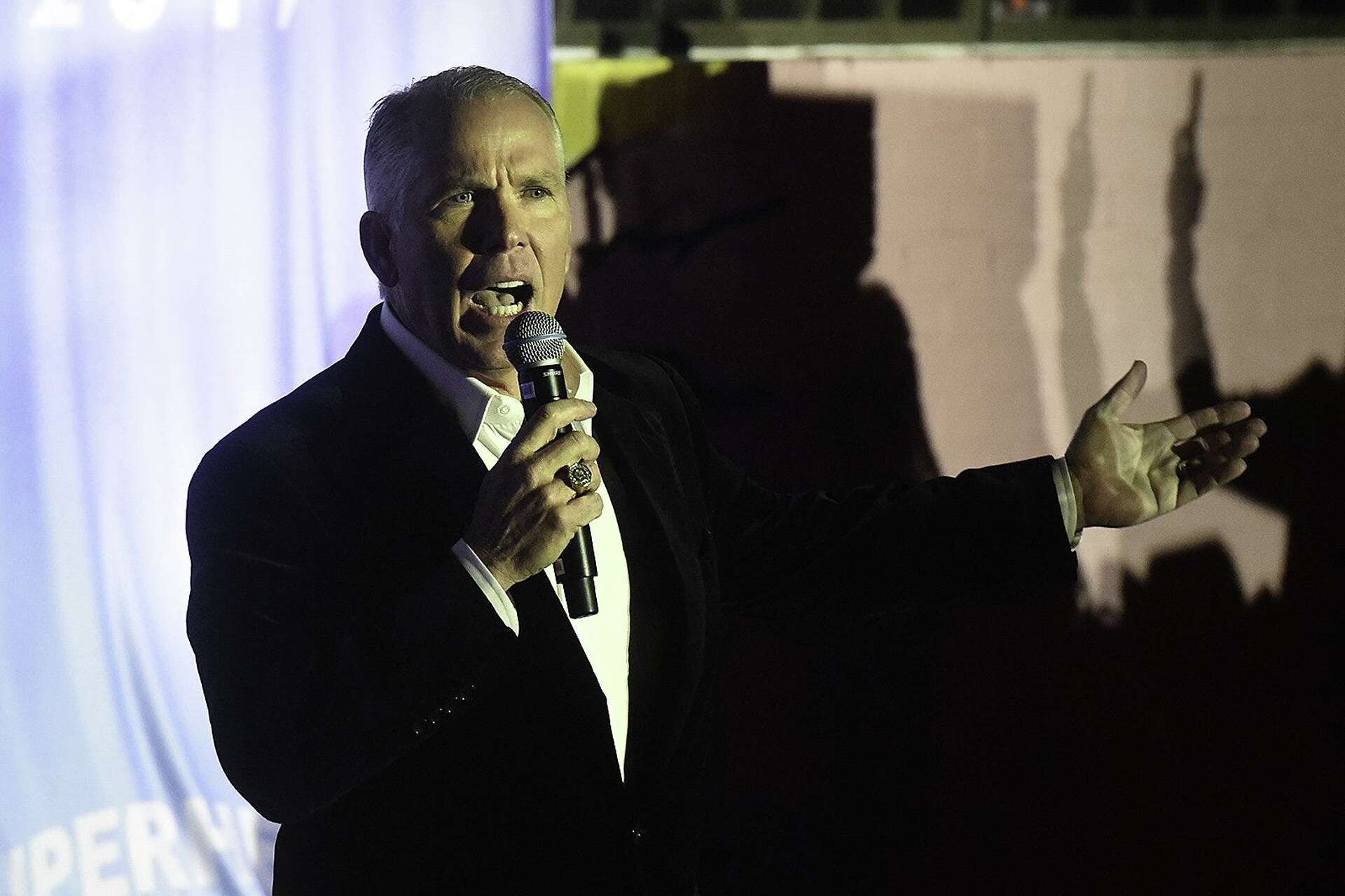 Thomas J. Henry introduces street artist Alec Monopoly before the unveiling of Monopoly's new mural on Friday Nov. 8, 2019, at Parlor & Yard at 601 West Sixth S