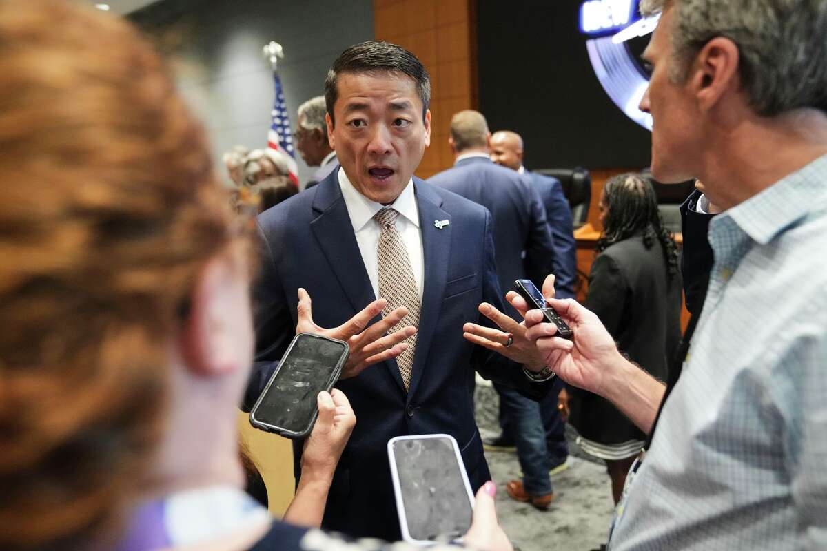 Democratic Texas Rep. Gene Wu, center, speaks with the media following a press conference with other Texas House Democrats and Democratic members of Congress at the Democratic Party in Warrenville, Ill., Monday, Aug. 4, 2025.