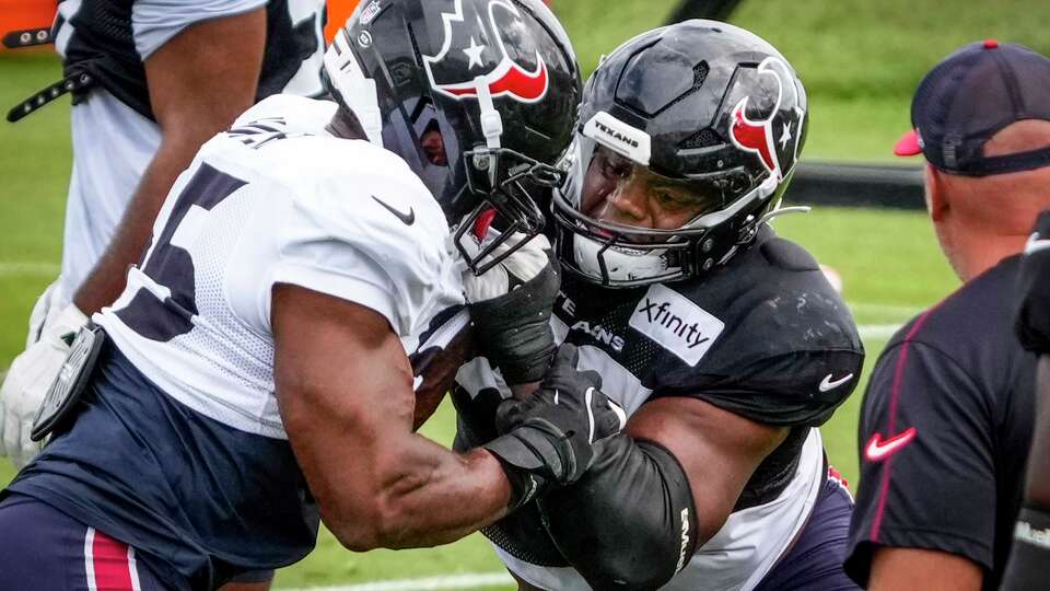 Houston Texans defensive end Danielle Hunter, left, goes up against offensive tackle Aireontae Ersery during an NFL training camp practice at The Greenbrier Sports Performance Center in White Sulphur Springs, W.Va., Tuesday, Aug. 5, 2025.